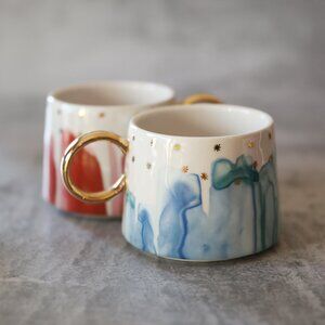 Anthropologie Night Sky Blue and Pink with Gold Mugs